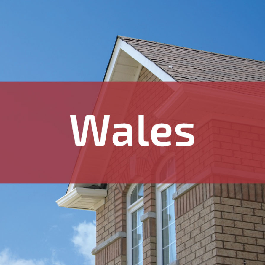 the front of a modern brick house with wales written across the image. This is to represent building fire regulations in wales.